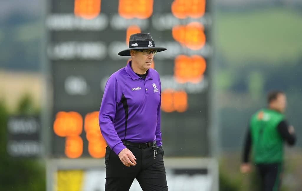 27 August 2022; Match umpire Roly Black during the Clear Currency Irish Senior Cup Final match between Lisburn and CIYMS at Bready Cricket Club in Bready, Tyrone. Photo by Ramsey Cardy/Sportsfile