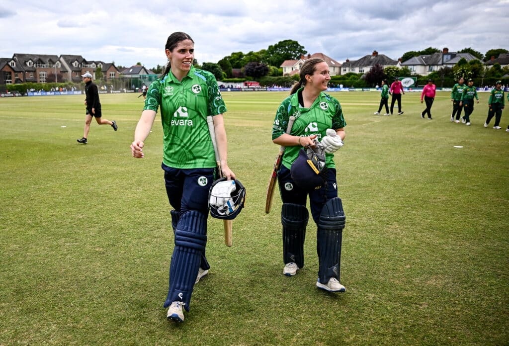 Rebecca Stokell and Leah Paul walk off the field after win