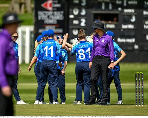 7 May 2023; Dragons players celebrating the wicket of Bella Armstrong of Dragons during the Evoke Super Series 2023 match between Dragons and Typhoons at Lisburn Cricket Club, Wallace Park in Lisburn, Down. Photo by Oliver McVeigh/Sportsfile