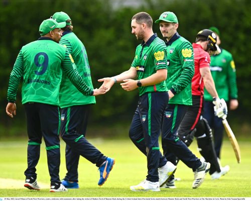 15 May 2023; Jared Wilson of North West Warriors, centre, celebrates with teammates after taking the wicket of Mathew Ford of Munster Reds during the Cricket Ireland Inter-Provincial Series match between Munster Reds and North West Warriors at The Mardyke in Cork. Photo by Eóin Noonan/Sportsfile
